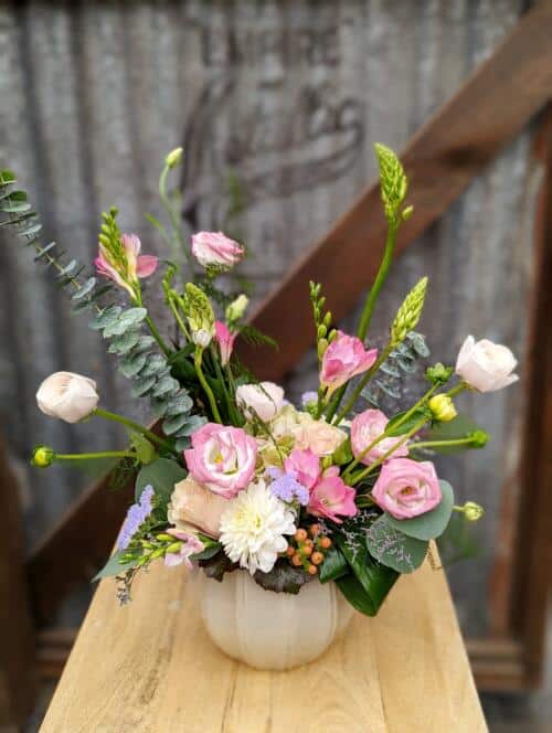 The Watering Can | A lively pink and white European style arrangement in a round beige ceramic container,