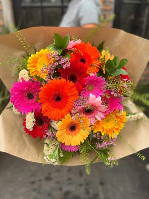 The Watering Can | A bright and colourfuln hand-tied gerbera daisy bouquet.