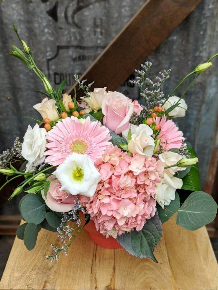 The Watering Can | A large but compact bouquet in pinks and whites.