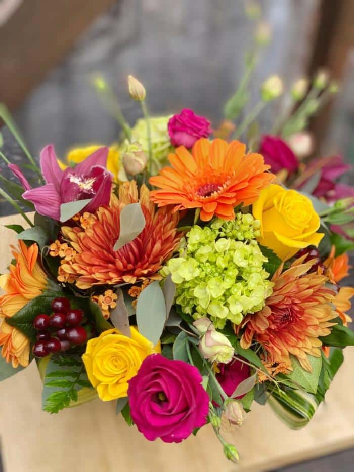 The Watering Can | View from above of the many colourful blooms in a Euopean style arrangement.
