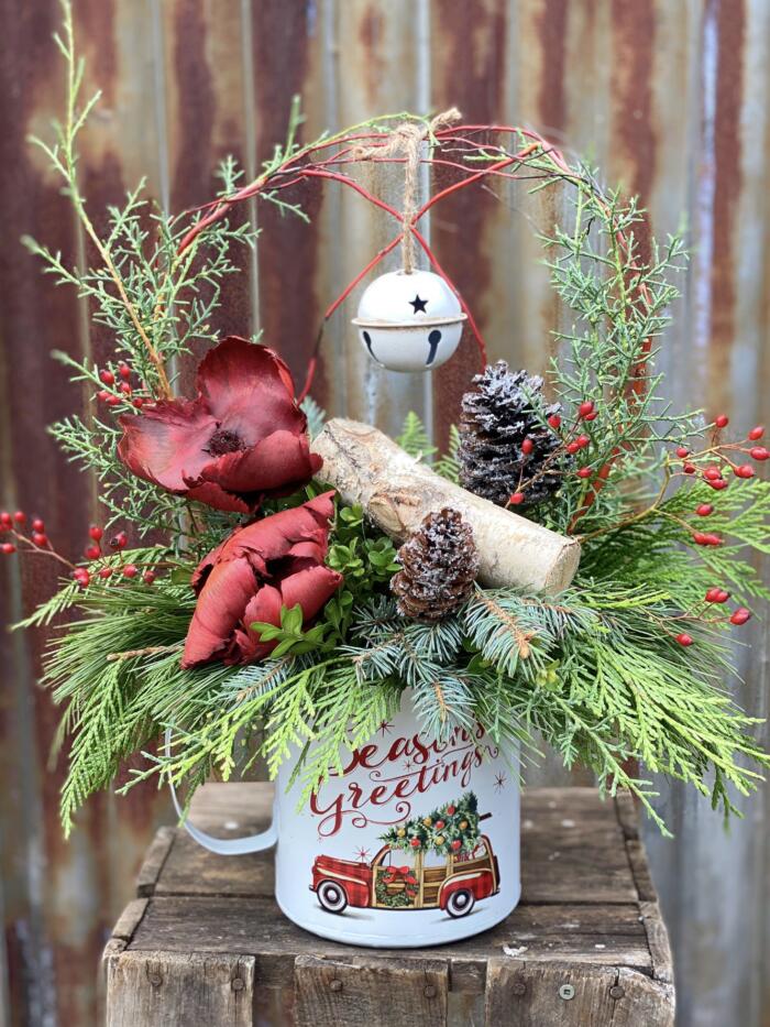 The Watering Can | A cheerful festive arrangement designed in a large Christmas mug.