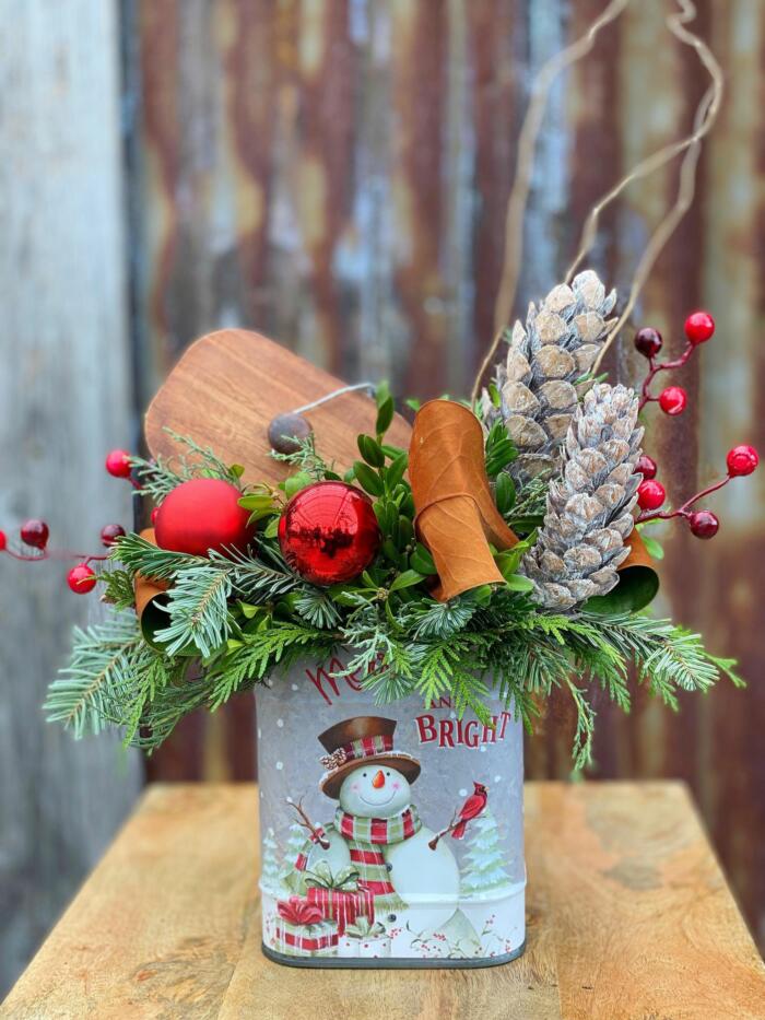 The Watering Can | A festive arrangement sprouting out of a vintage tin container.
