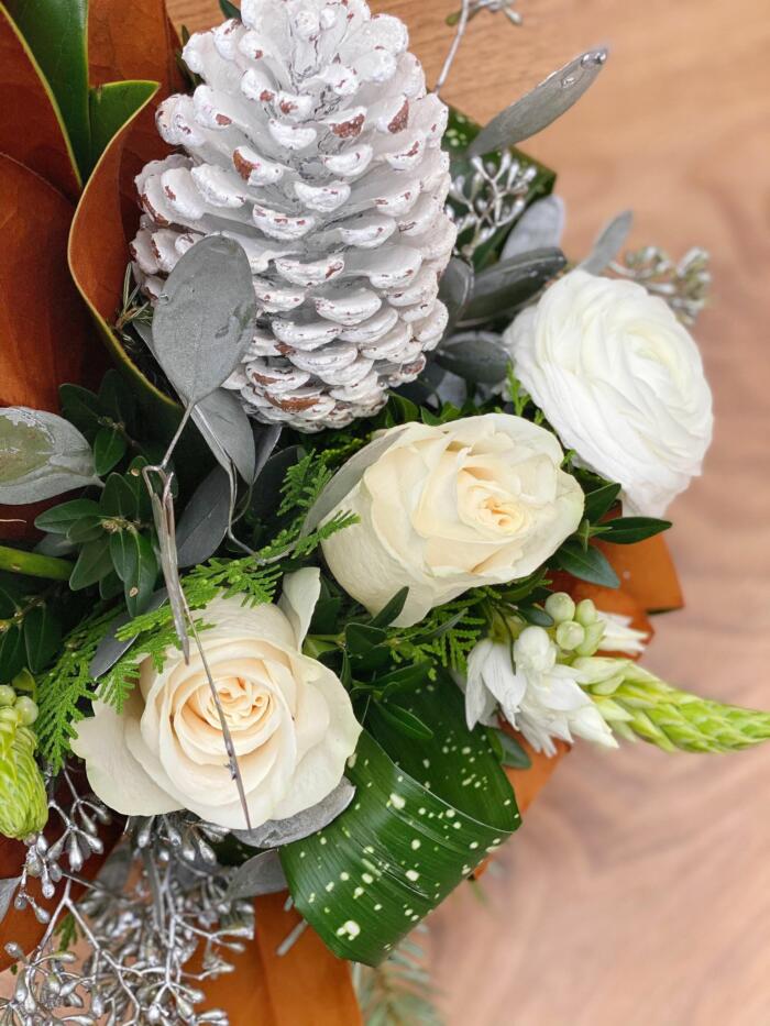 The Watering Can | Close up of the white roses and ranunculus in a winter European design.